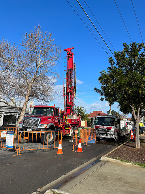 Schramm rig set up on public road with safety guards